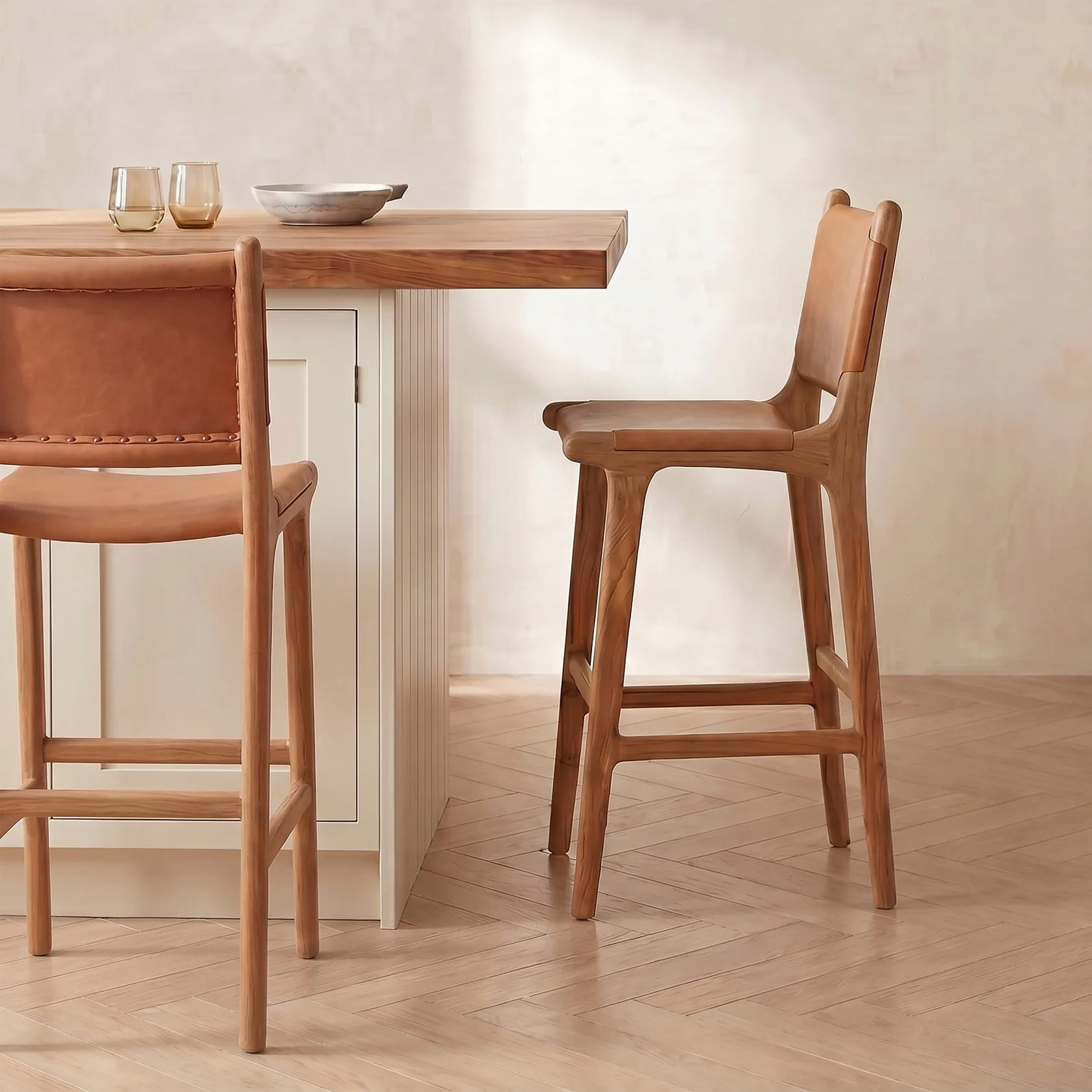 leather bar stool against a cream kitchen island