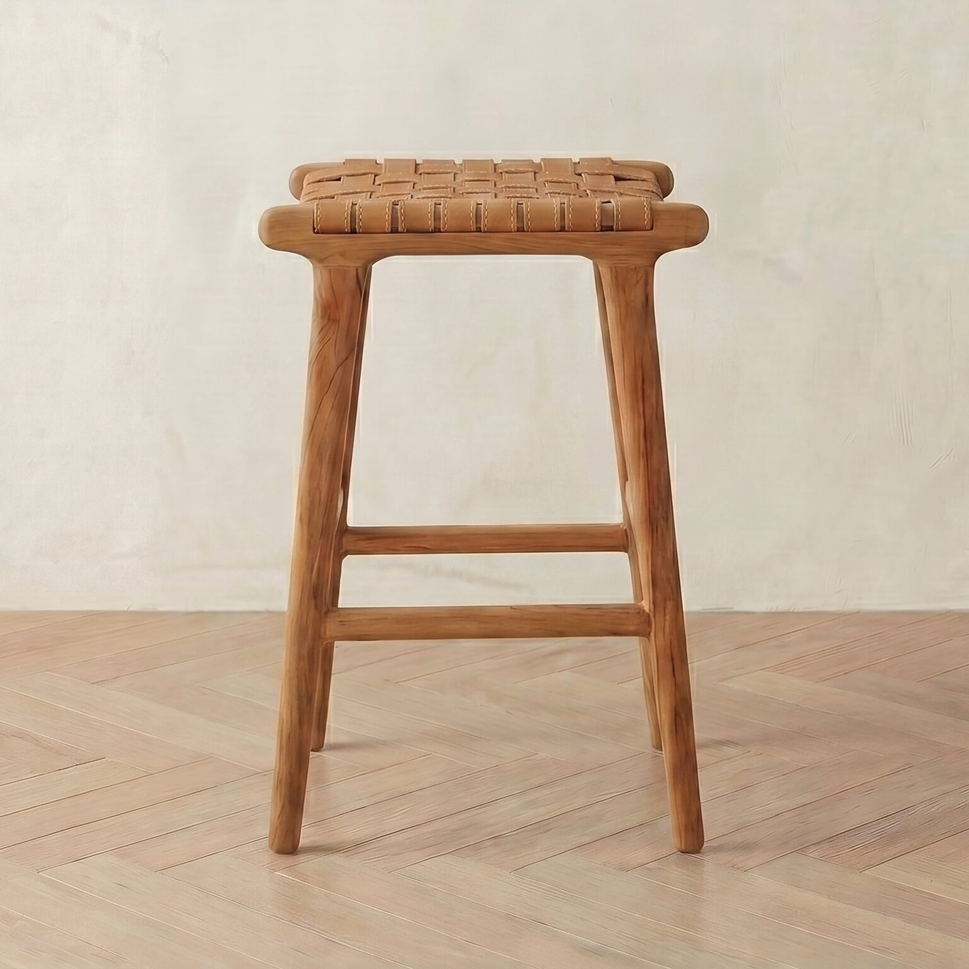 leather bar stool with woven seat on a wooden floor