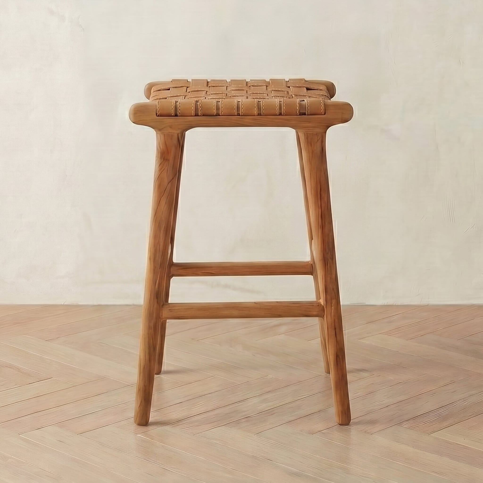 leather bar stool with woven seat on a wooden floor