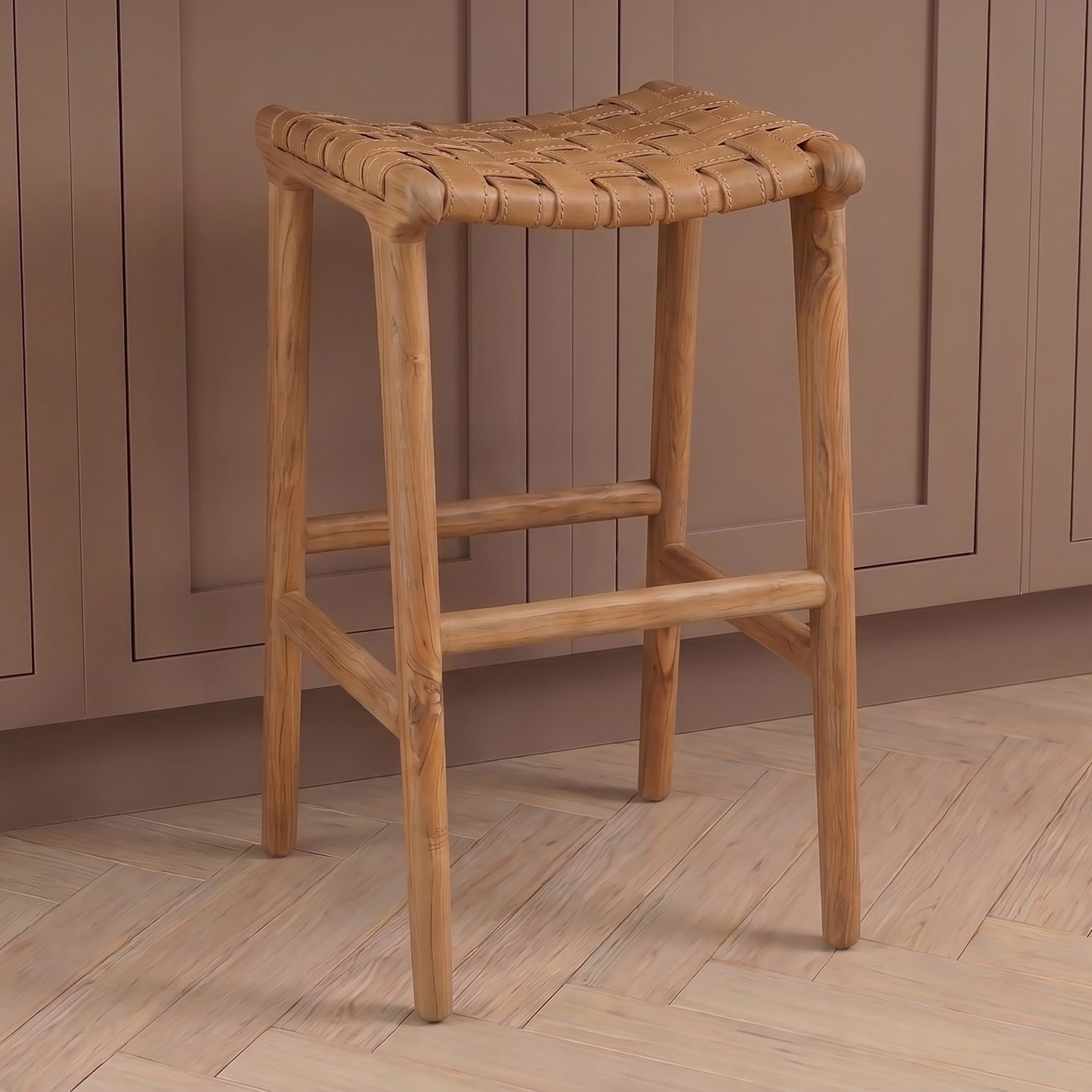 Leather bar stool with woven seat against a wooden panel background
