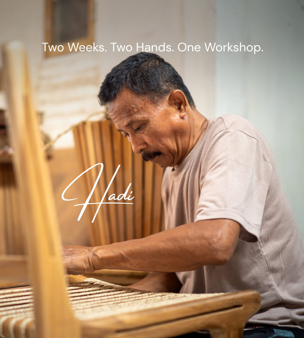 A man seated at a wooden loom weaving a handwoven basket or chair in a workshop, with overlaid text reading 'Two Weeks. Two Hands.