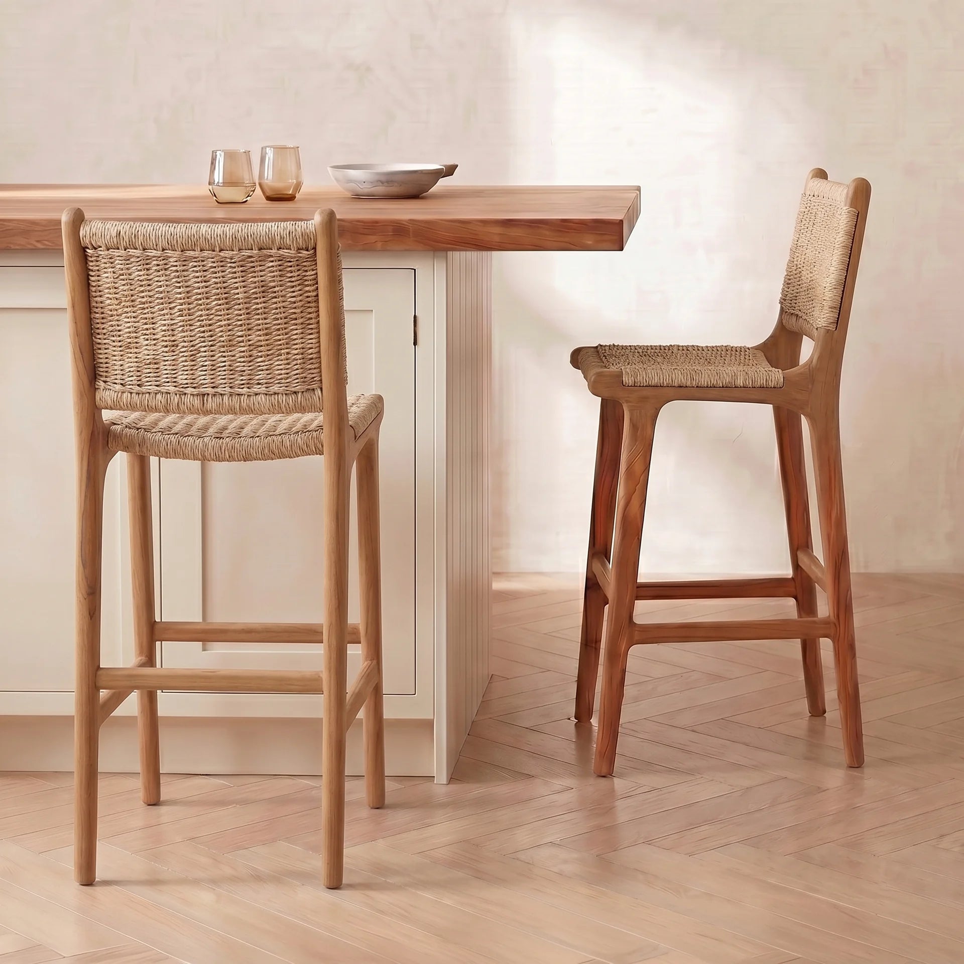 Rattan bar stools against a cream kitchen island